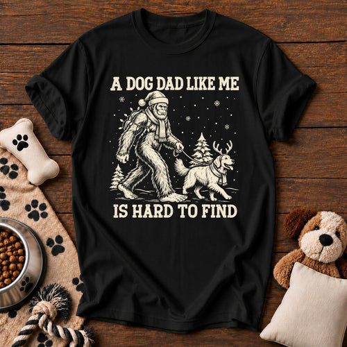 Bigfoot Dog Dad Christmas Tee — funny dog t-shirt in Black, Comfort Colors 1717 flat lay
