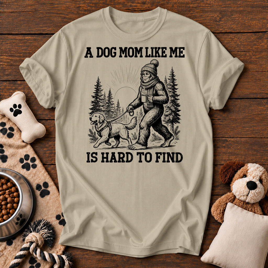 Bigfoot Dog Mom Tee — funny dog t-shirt in Sandstone, Comfort Colors 1717 flat lay