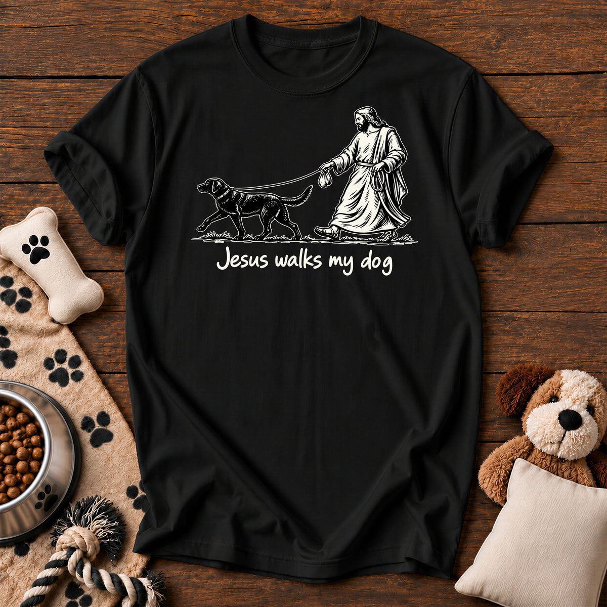 Jesus Walks My Dog Tee — funny Christian dog t-shirt in Black, Comfort Colors 1717 flat lay