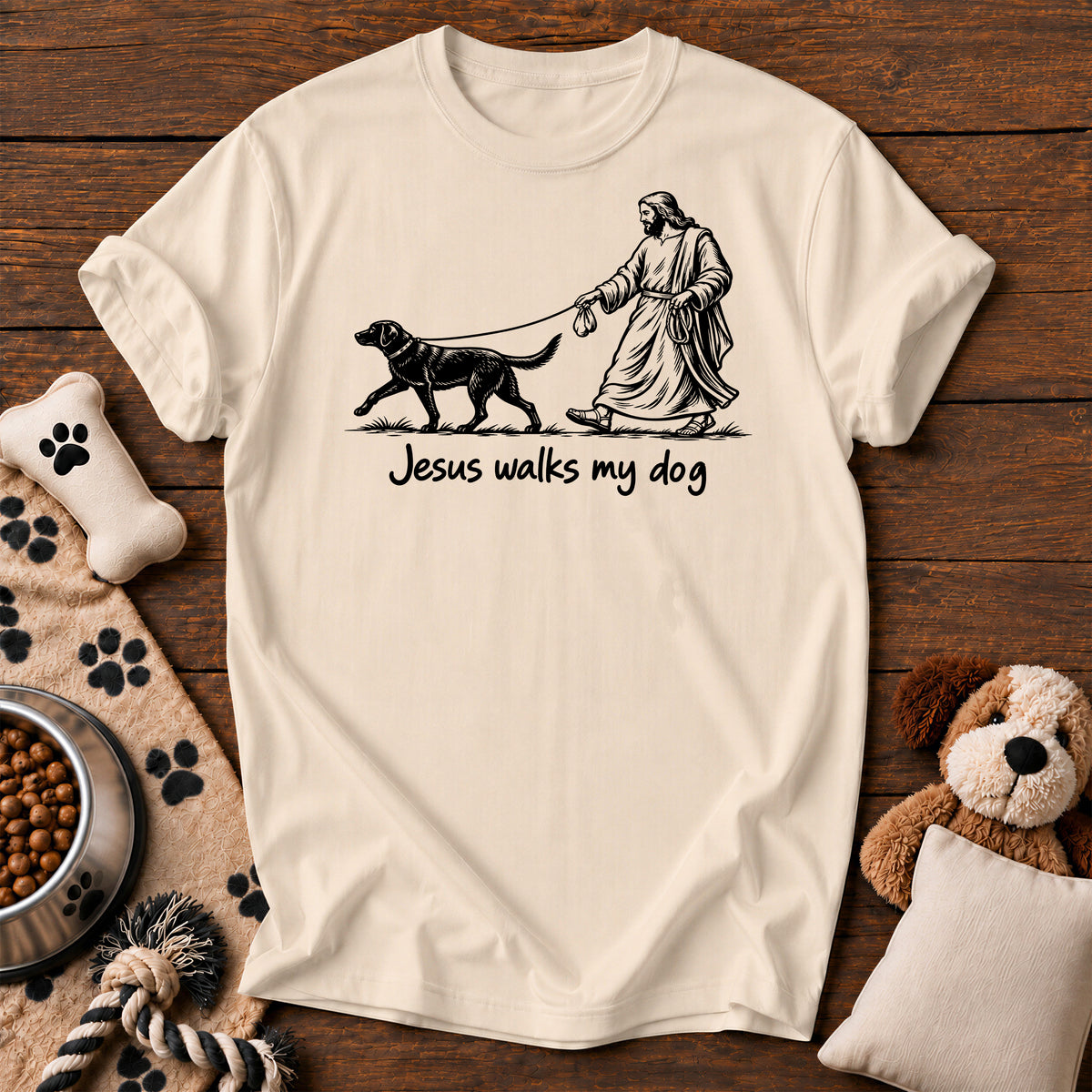 Jesus Walks My Dog Tee — funny Christian dog t-shirt in Ivory, Comfort Colors 1717 flat lay