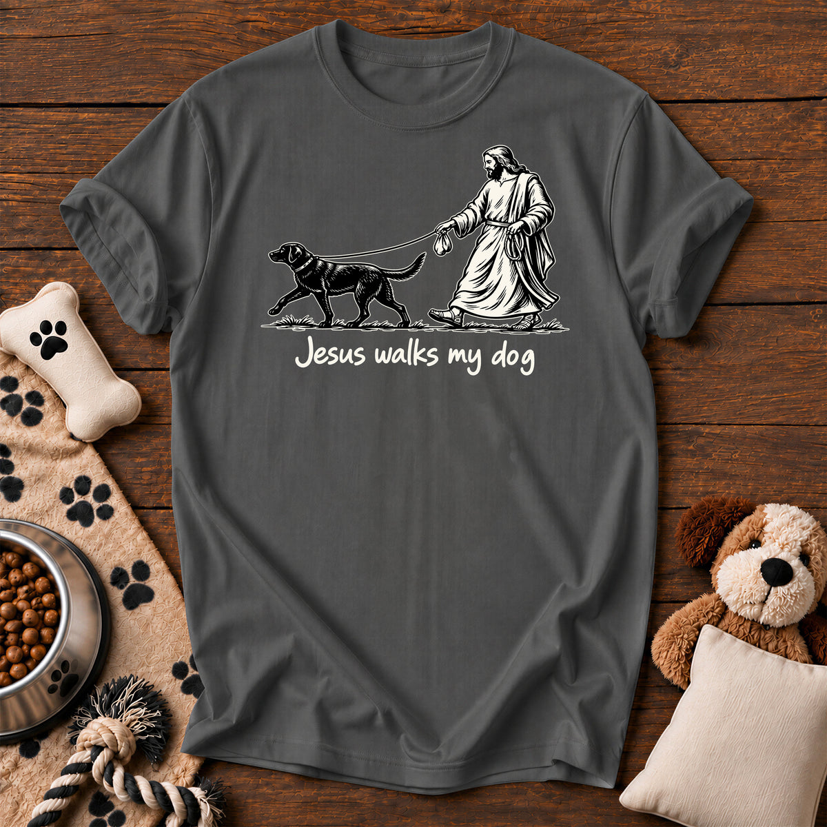 Jesus Walks My Dog Tee — funny Christian dog t-shirt in Pepper, Comfort Colors 1717 flat lay